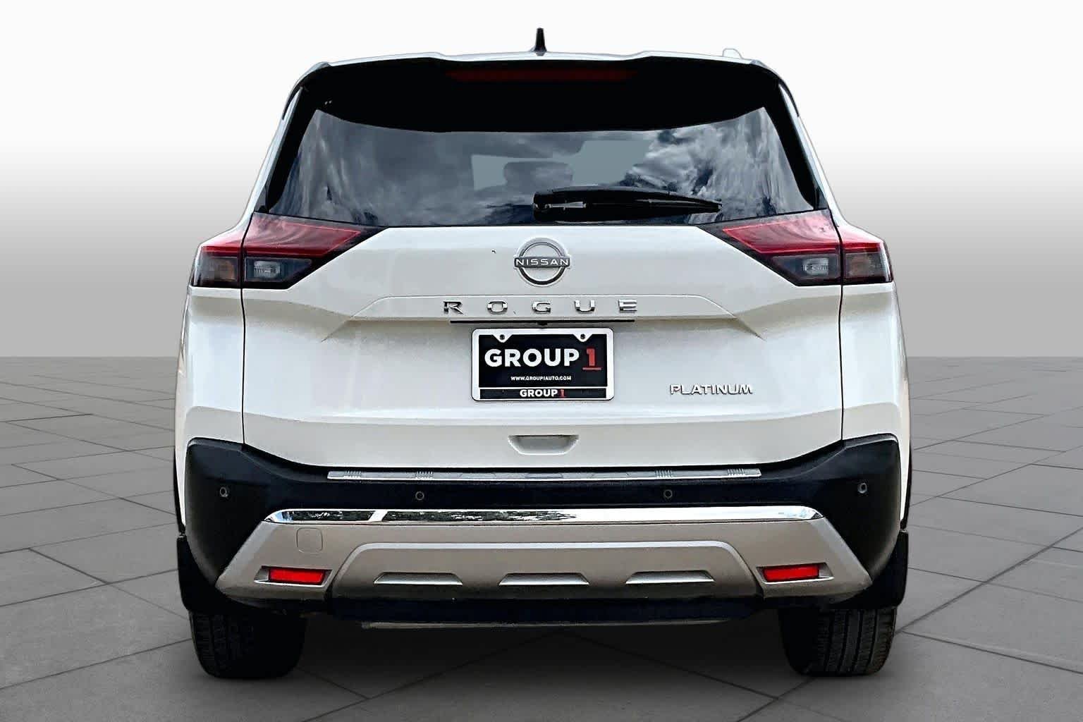 Used 2023 Pearl White Tricoat/Super Black Nissan Platinum image 4