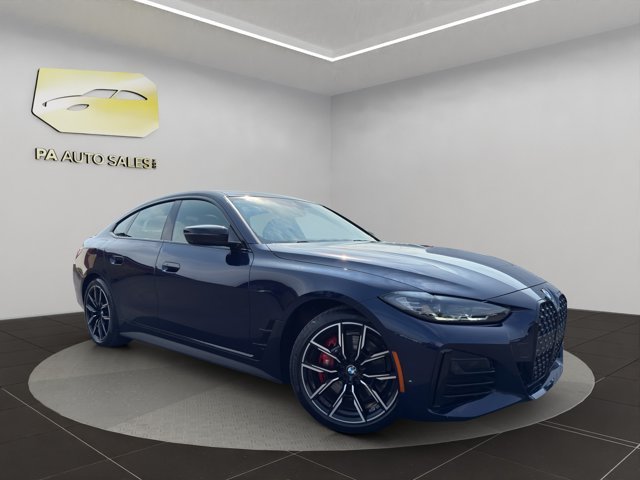 Used 2024 Tanzanite Blue II Metallic BMW 430i xDrive image 1
