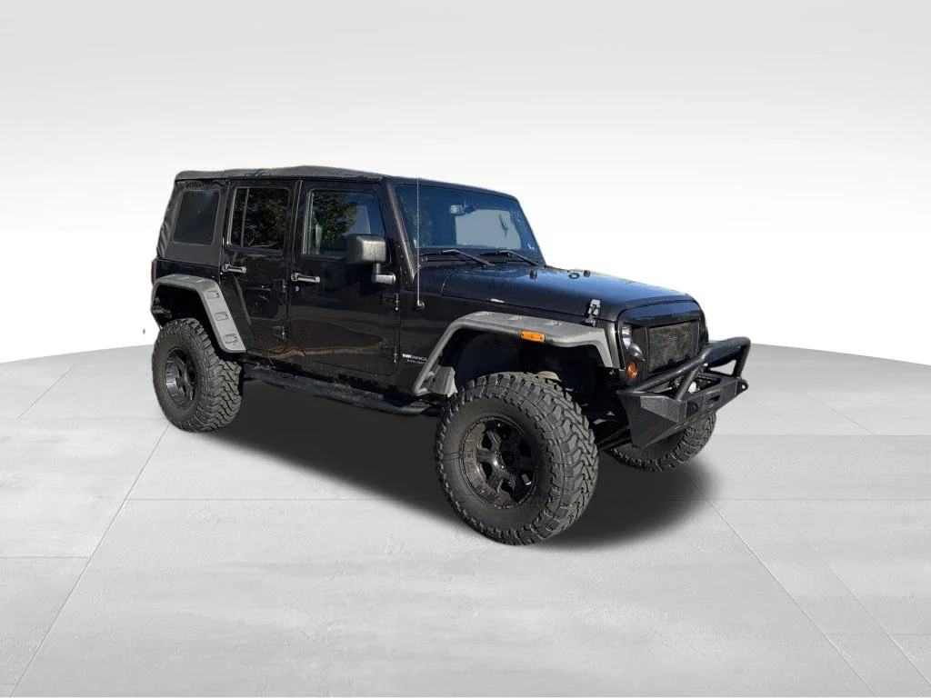 Used 2013 Brown Jeep Unlimited Sport image 2