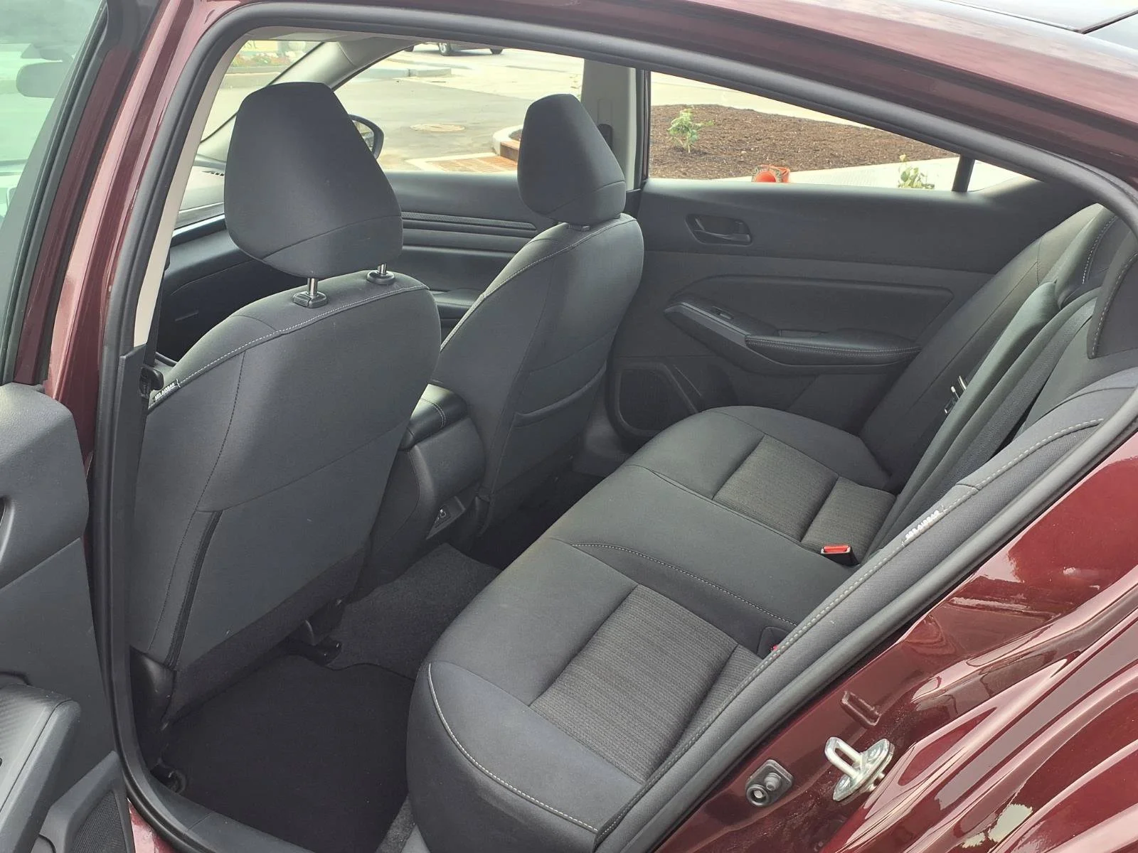 Used 2025 Garnet Pearl Metallic Nissan SV image 21
