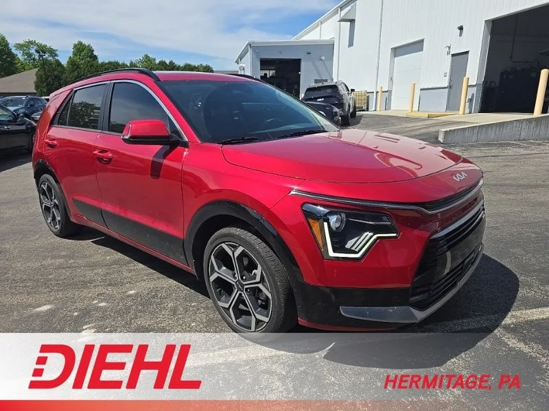 Used 2024 Red Kia EX Touring image 1