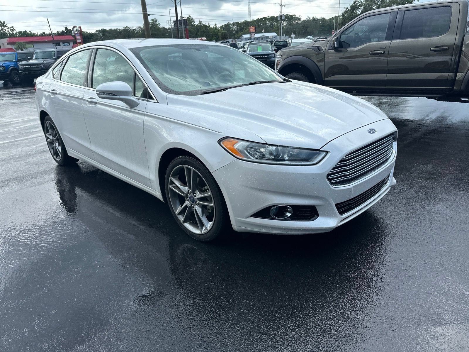 Used 2014 Ford Fusion Titanium with VIN 3FA6P0K98ER335487 for sale in Spring Hill, FL