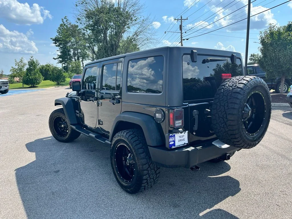 Used 2018 Black Jeep Unlimited Sport image 4