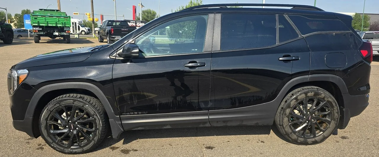 Used 2024 Black GMC SLE AWD image 2