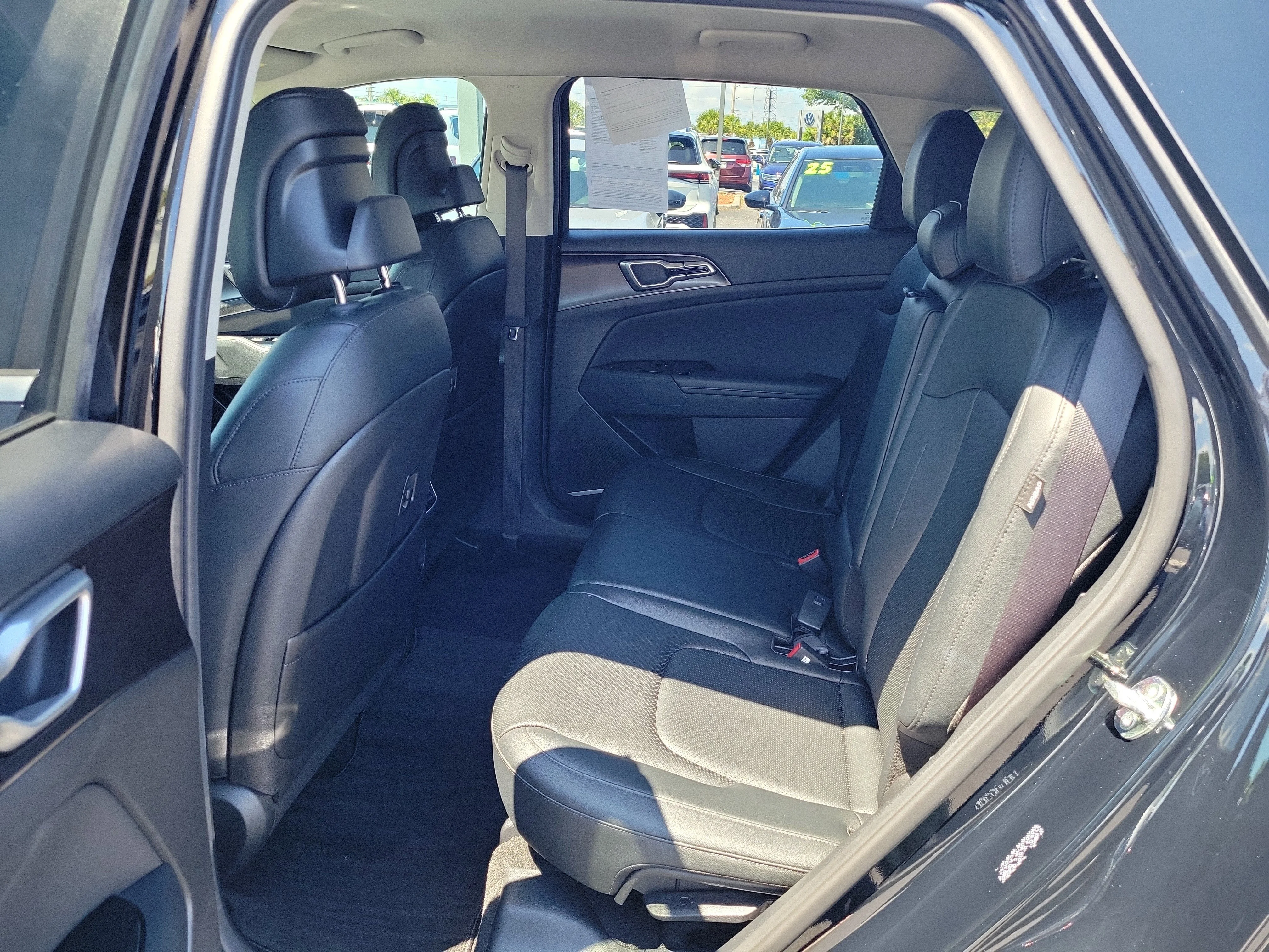Used 2025 Ebony Black Kia EX image 12
