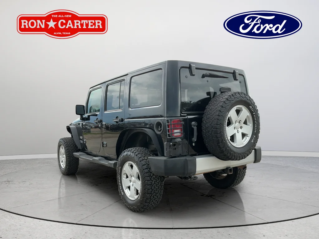 Used 2012 Black Jeep Unlimited Sahara image 4