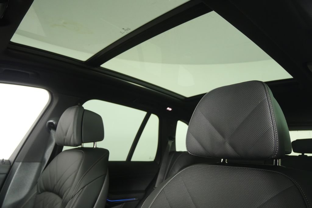 New 2026 Black Sapphire Metallic BMW xDrive50e image 11