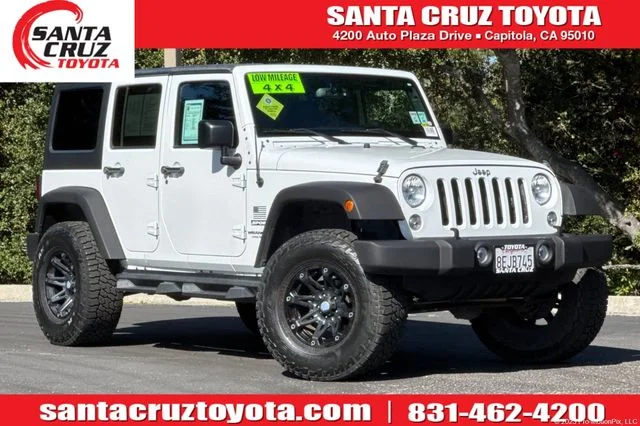 Used 2016 White Jeep Unlimited Sport image 1