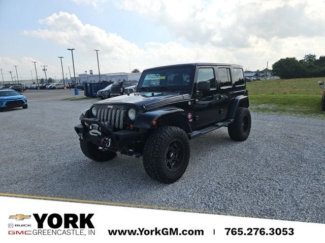 Used 2013 Black Jeep Unlimited Sahara image 1