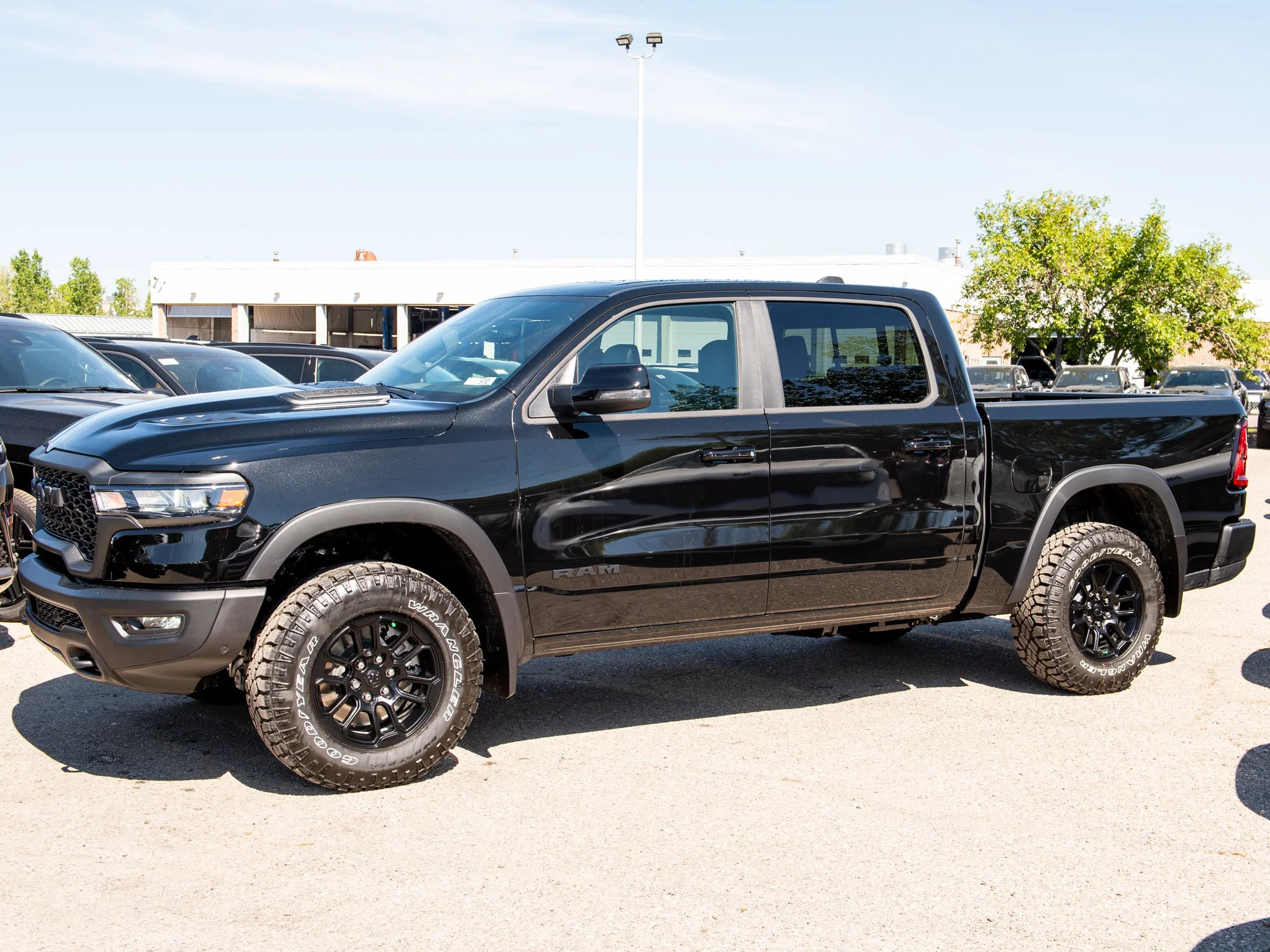 New 2026 Black RAM Rebel* Crew Cab 4x4, 33 Inch A/T Tires, Pano Sunroof, Passenger Screen image 4