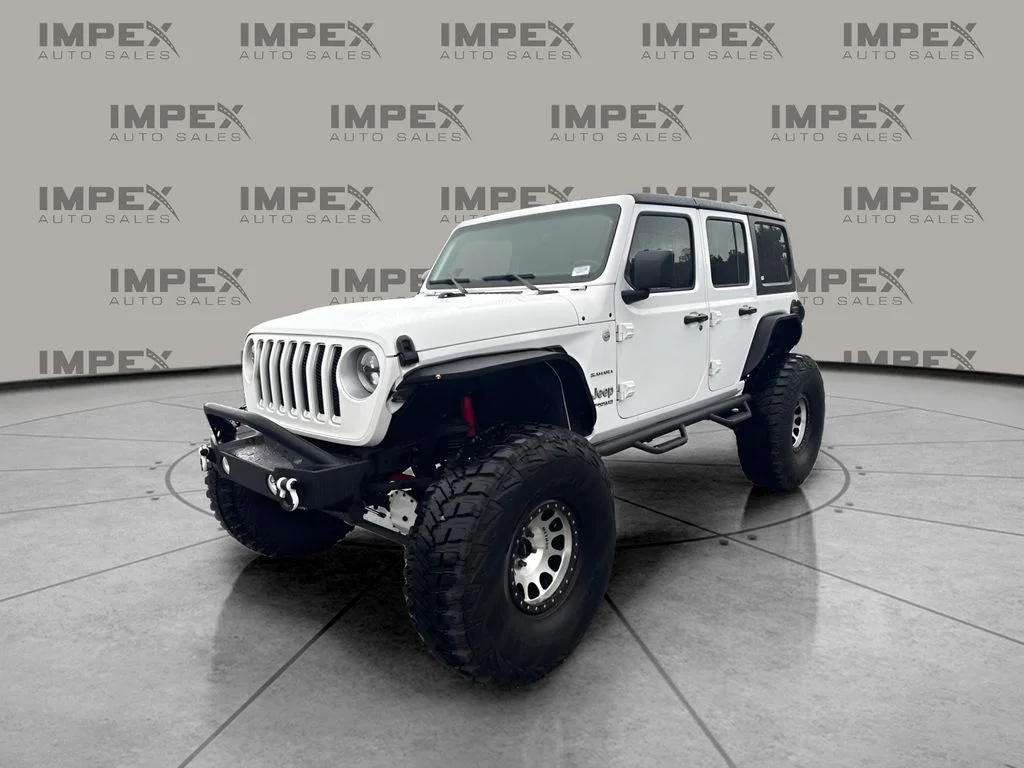 Used 2018 White Jeep Unlimited Sahara image 1