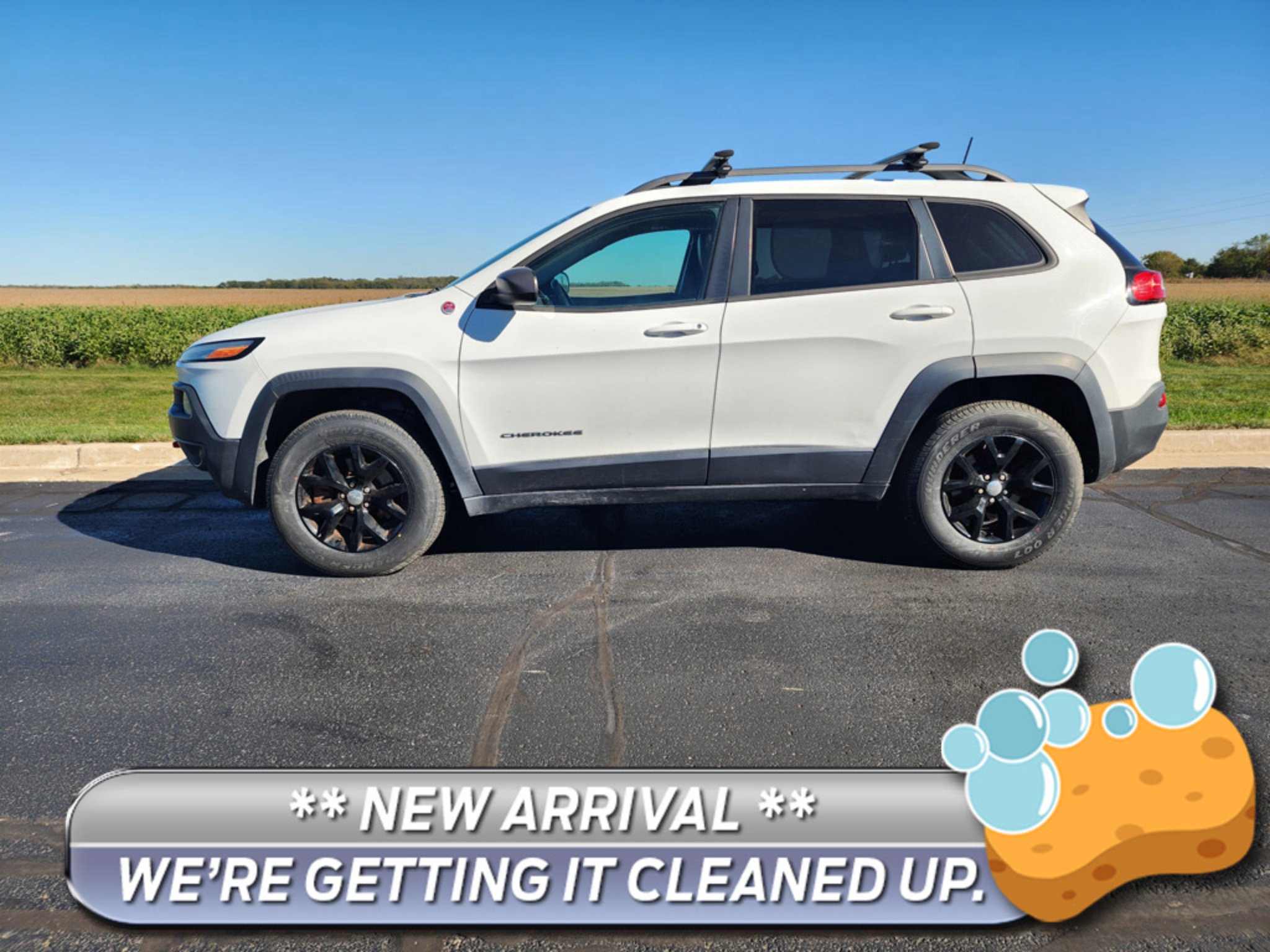 Used 2016 Bright White Jeep Trailhawk image 1