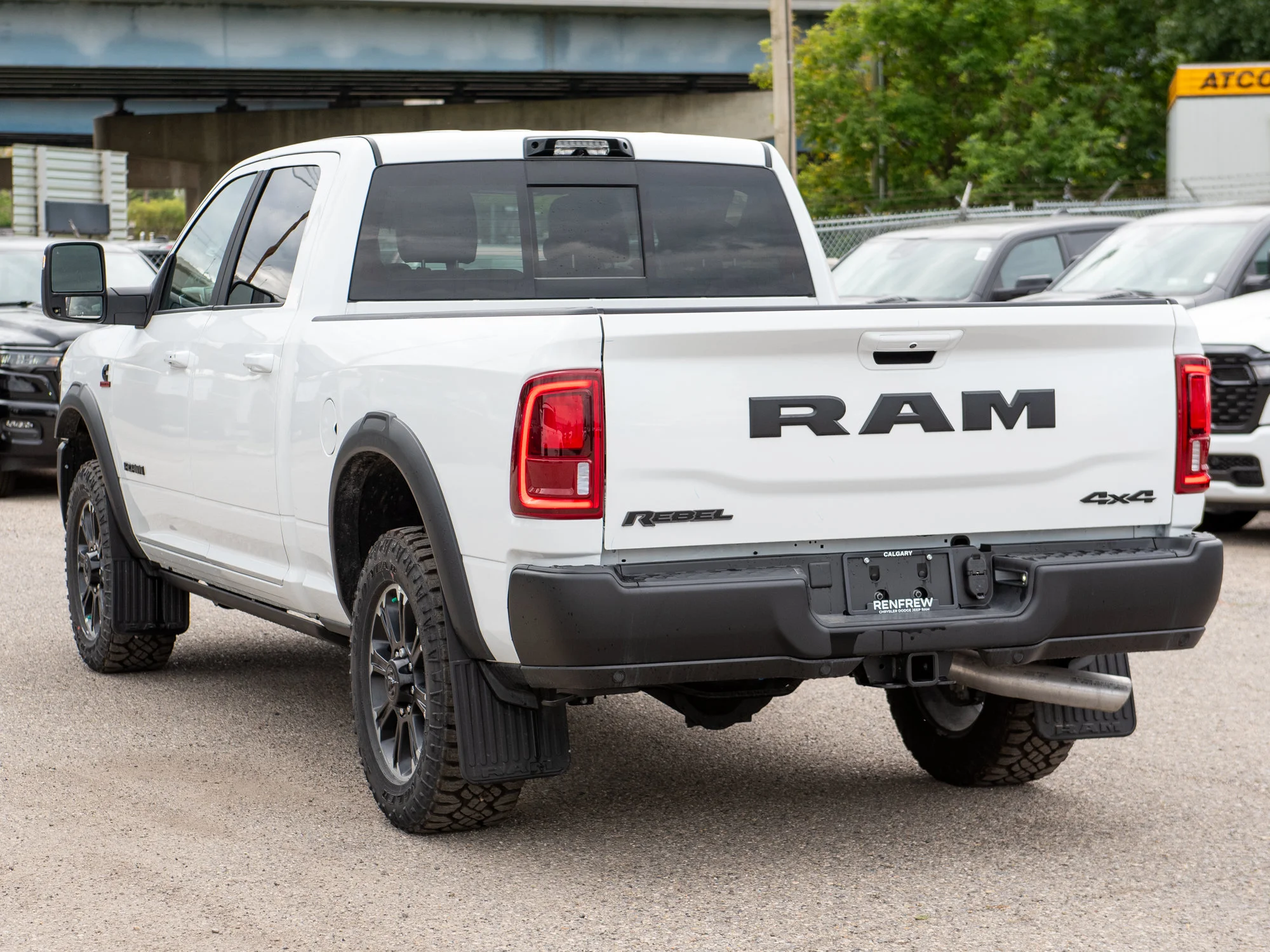 New 2026 White RAM Rebel* Crew Cab 4x4, 6.7L Cummins, Sunroof, 34 Inch A/T Tires, Passenger Screen image 5
