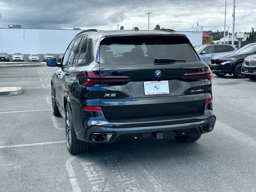 New 2026 Black Sapphire Metallic BMW xDrive50e image 3