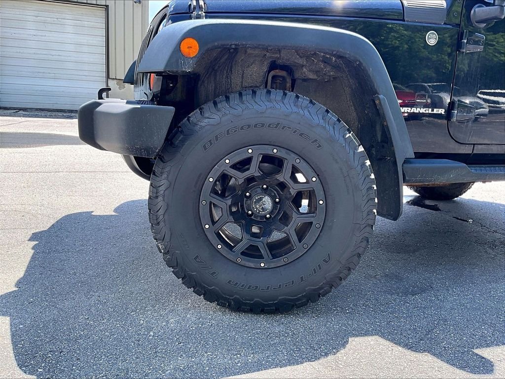 Used 2013 Black Clearcoat Jeep Sport image 4