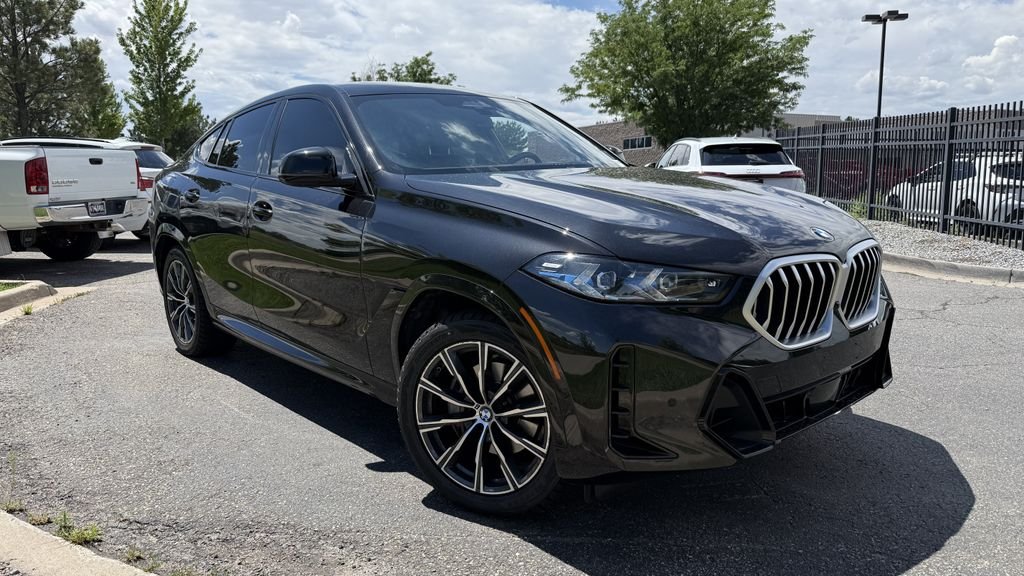 Used 2024 Black BMW xDrive40i image 1