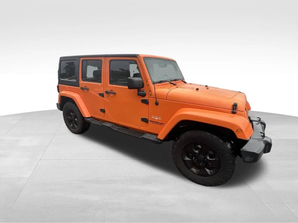 Used 2013 Orange Jeep Unlimited Sahara image 19