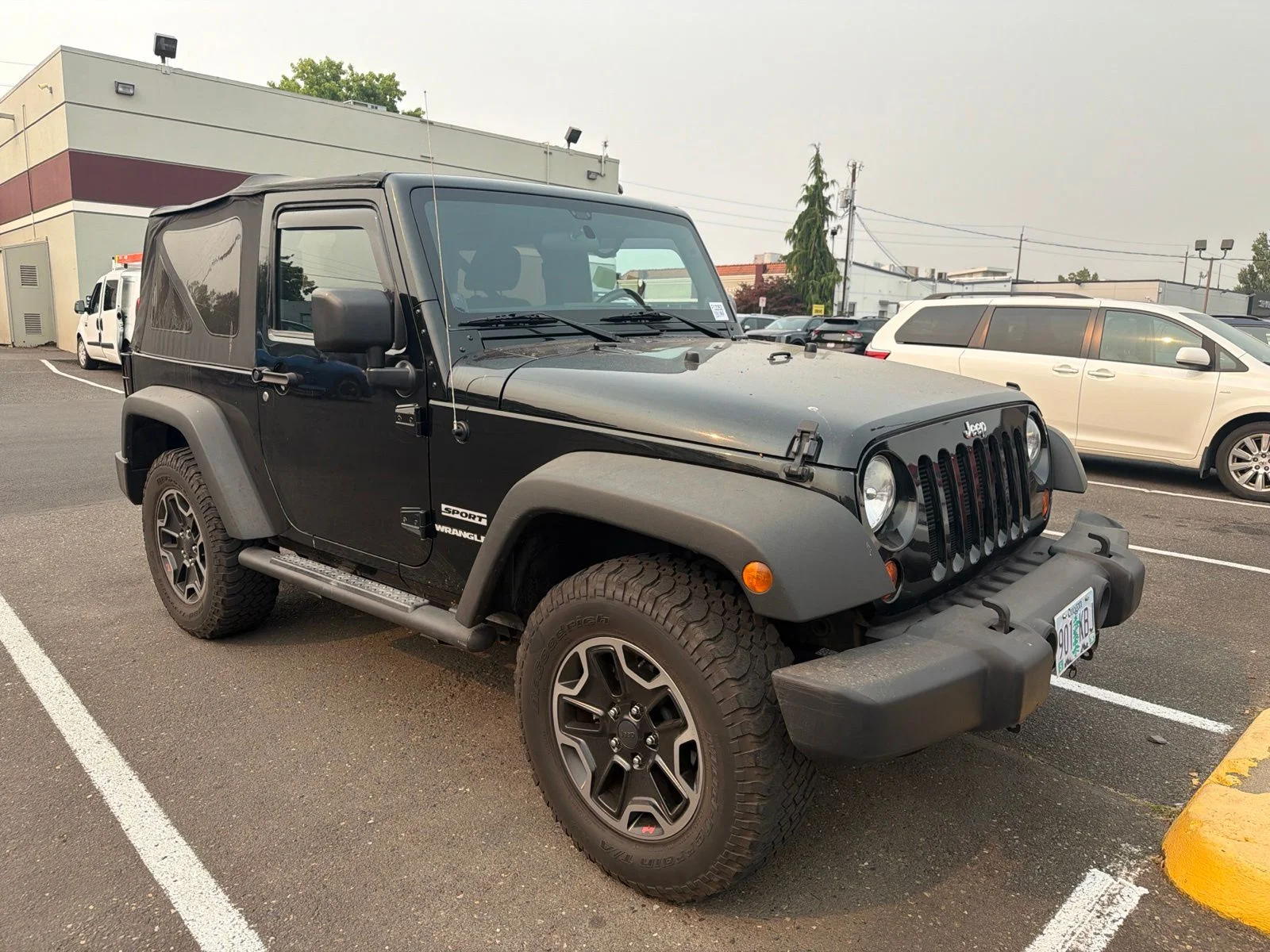 Used 2012 Black Jeep Sport image 2