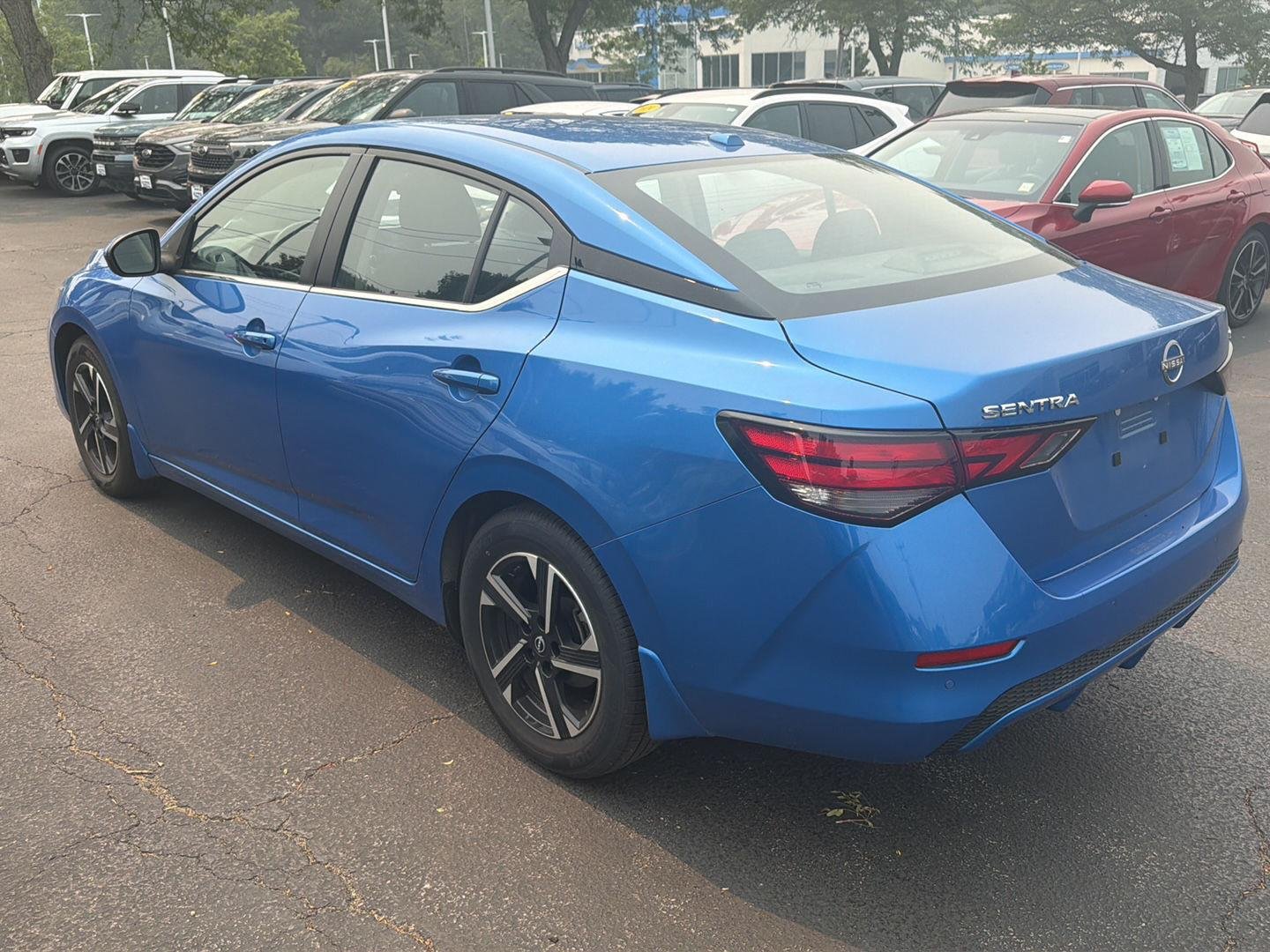 Used 2024 Electric Blue Metallic Nissan SV image 6