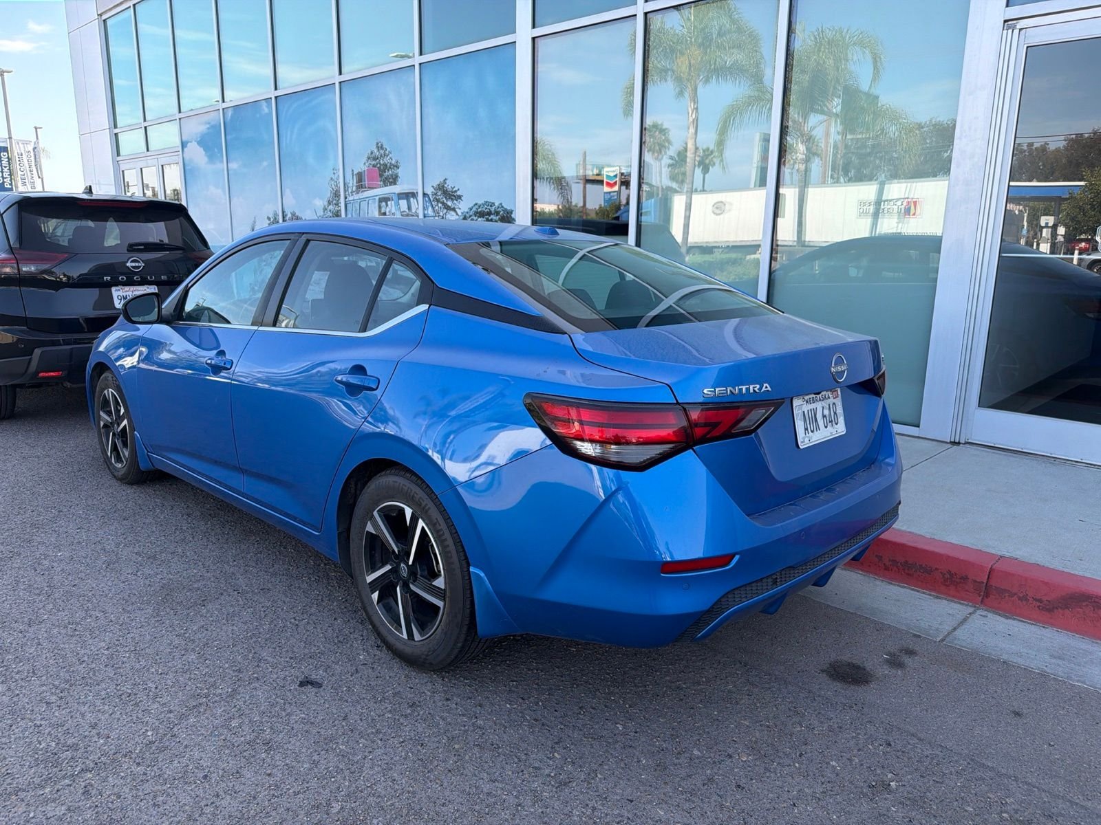 Used 2024 Electric Blue Metallic Nissan SV image 4