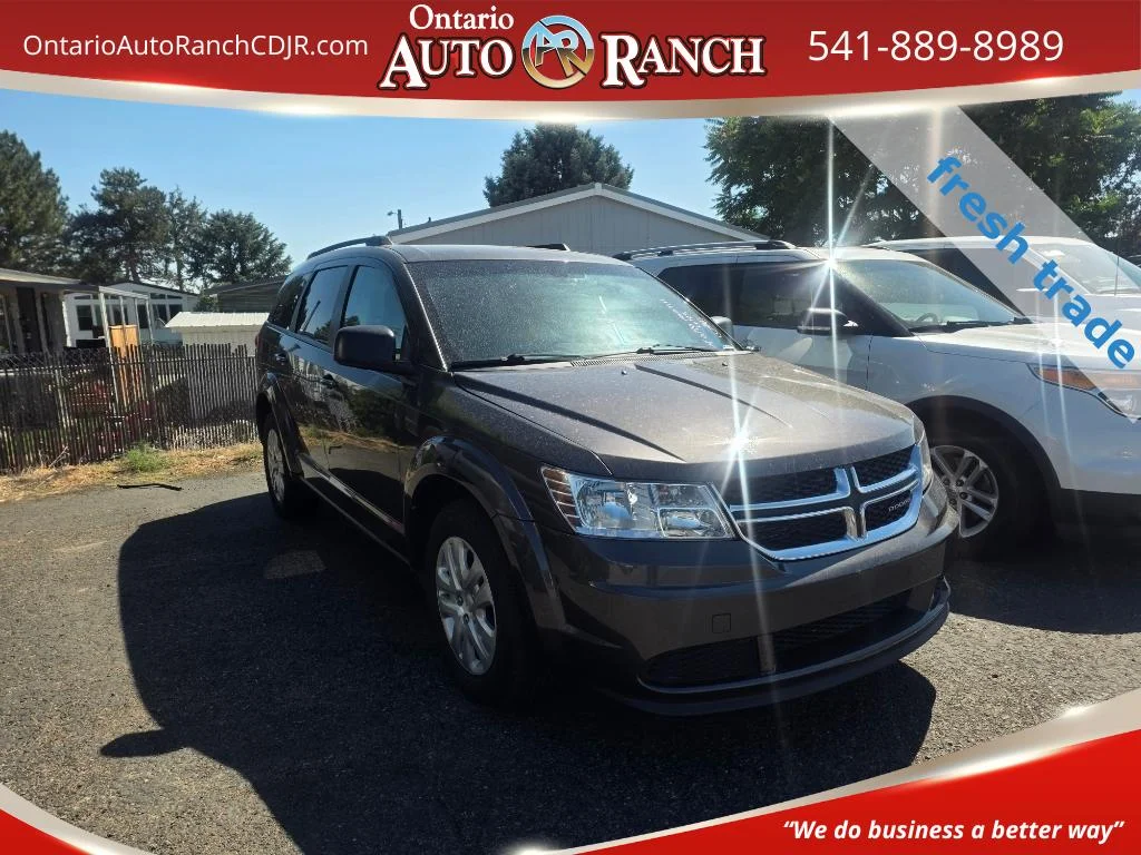 Used 2018 Granite Pearlcoat Dodge SE image 1