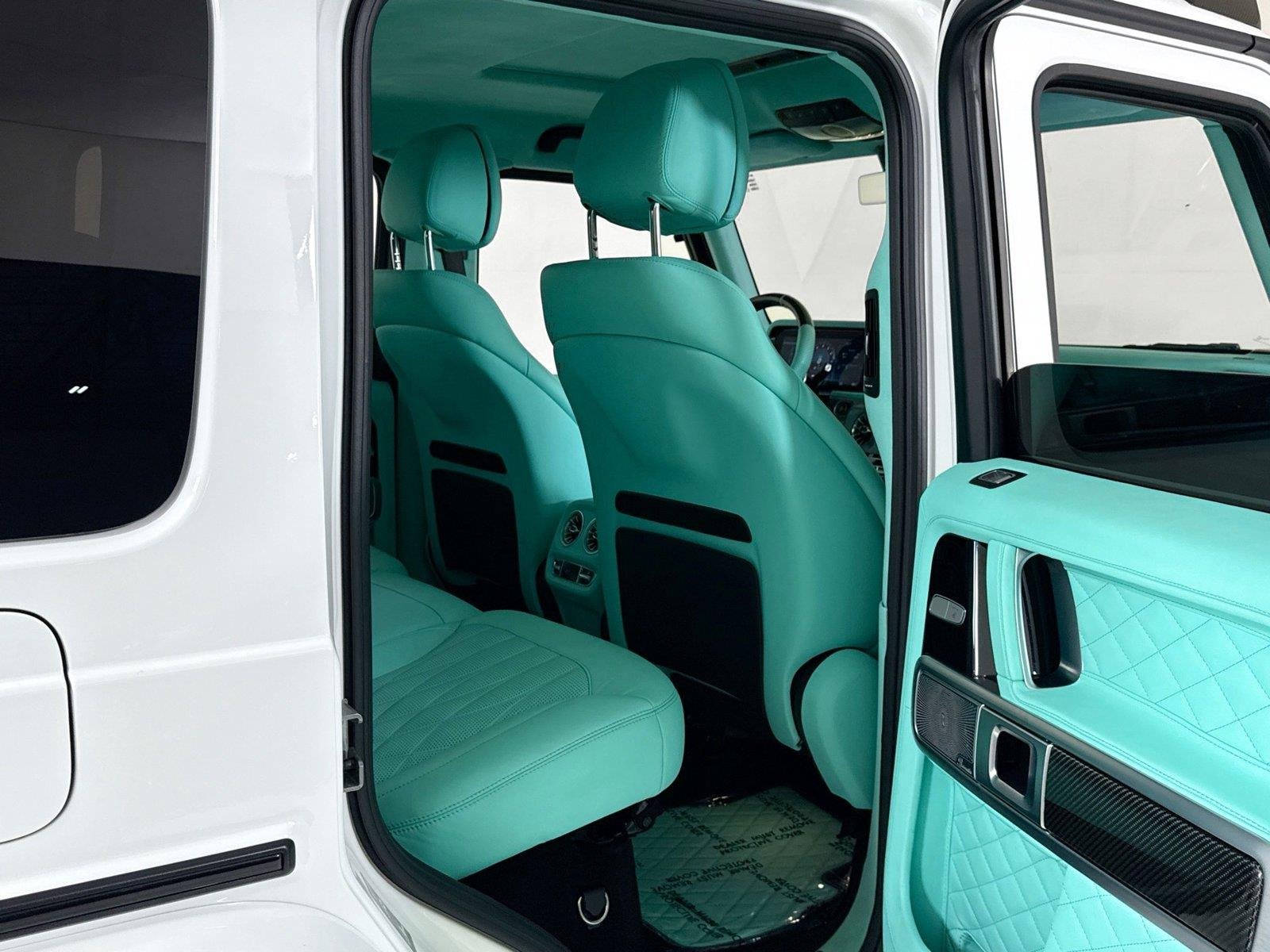 Used 2024 Polar White Mercedes-Benz AMG® G 63  Brabus Custom Widebody / Custom Tiffany Interior image 27