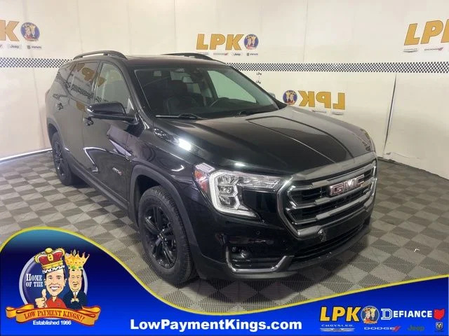 Used 2024 Ebony Twilight Metallic GMC AT4 image 1