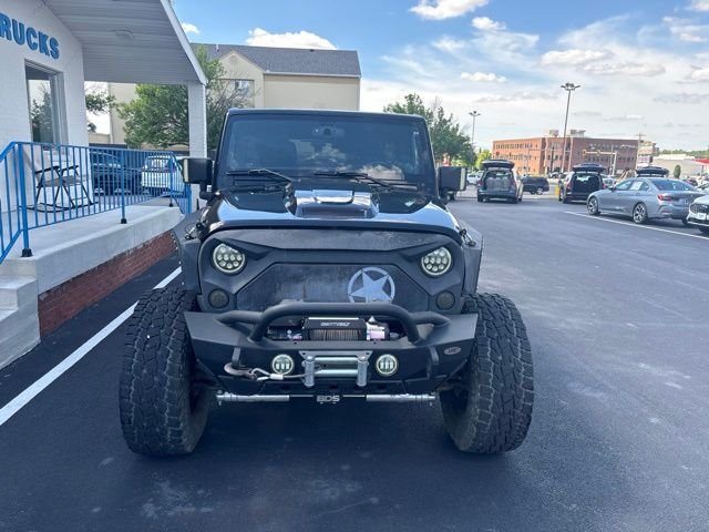 Used 2013 Black Jeep Unlimited Sahara image 1