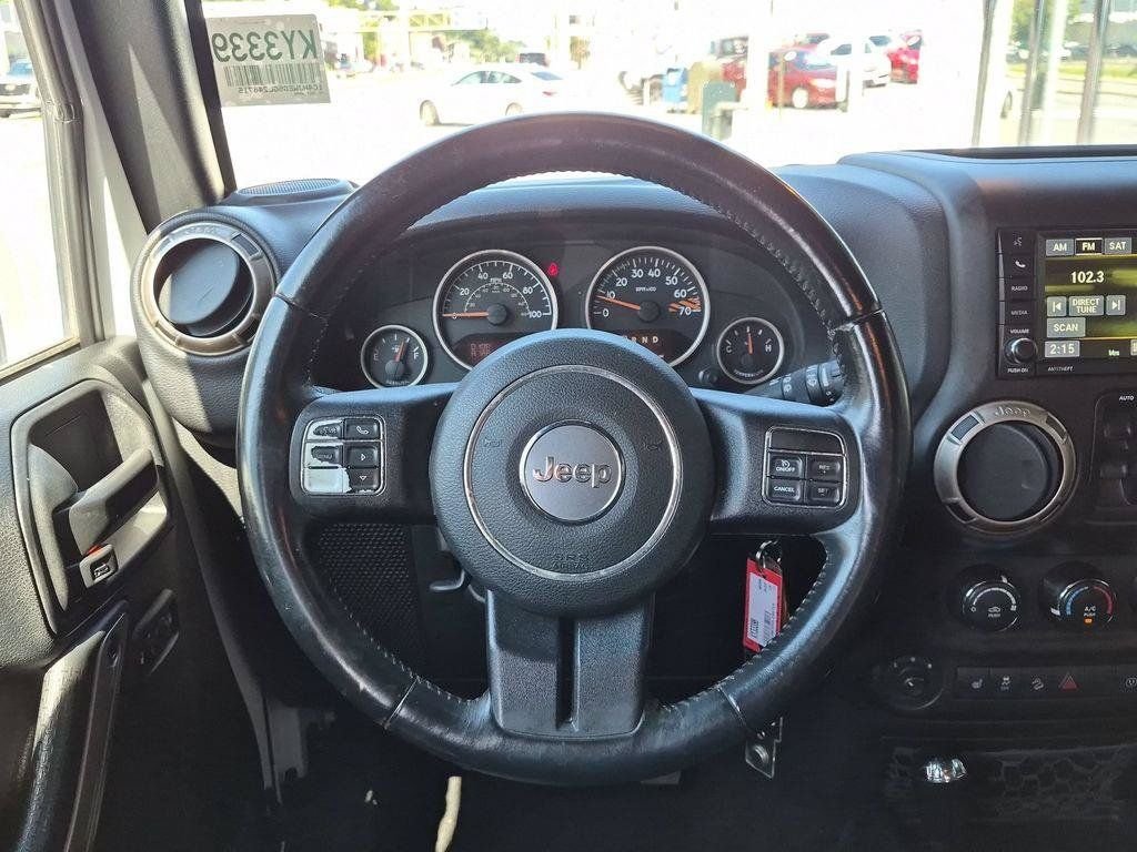 Used 2016 White Jeep Unlimited Sahara image 11