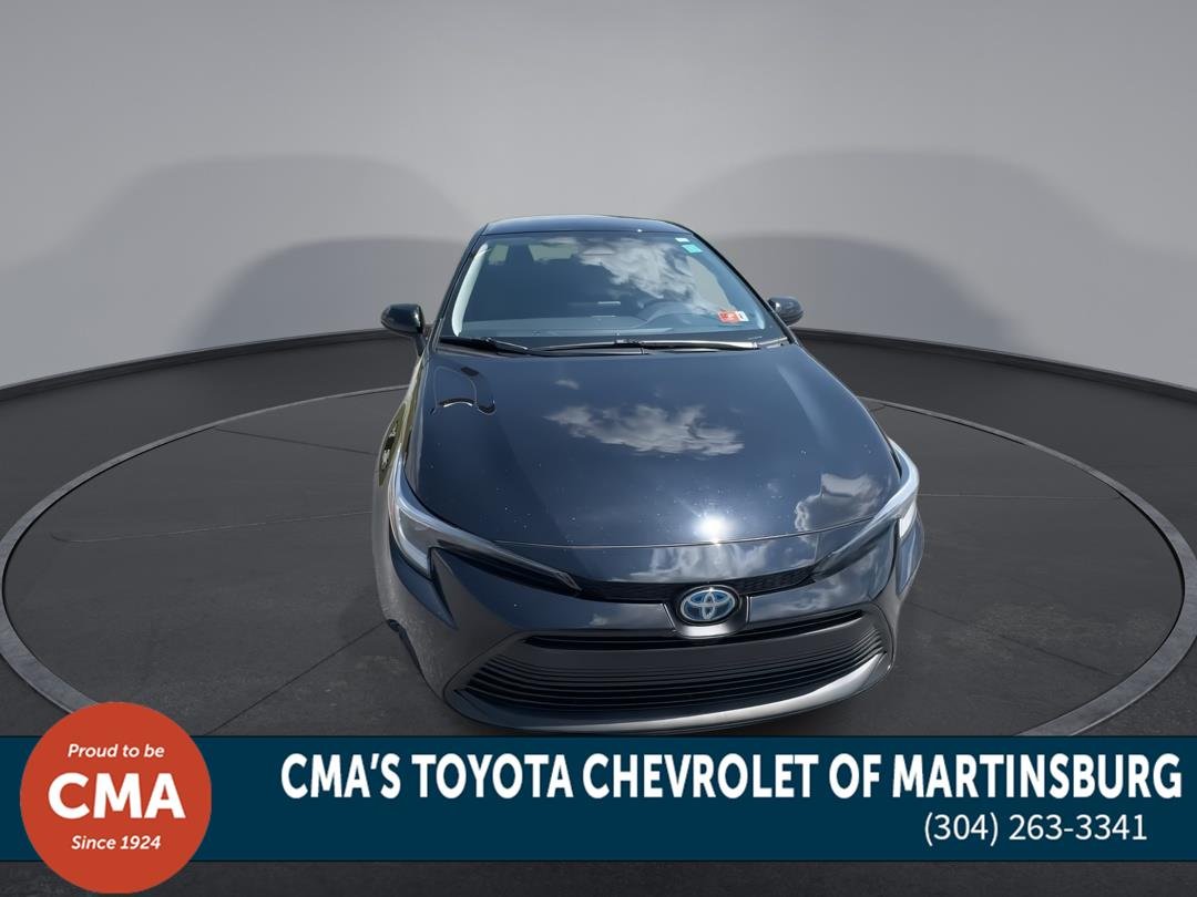 Used 2025 Midnight Black Metallic Toyota Hybrid LE image 3