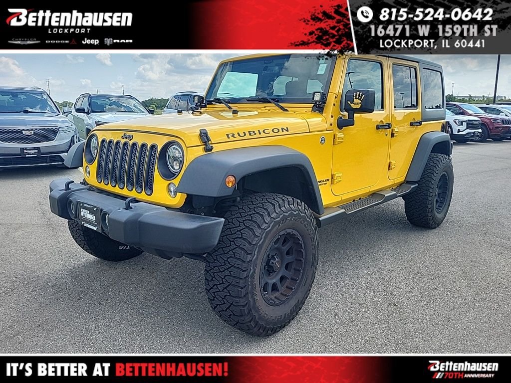 Used 2015 Yellow Jeep Unlimited Rubicon image 1