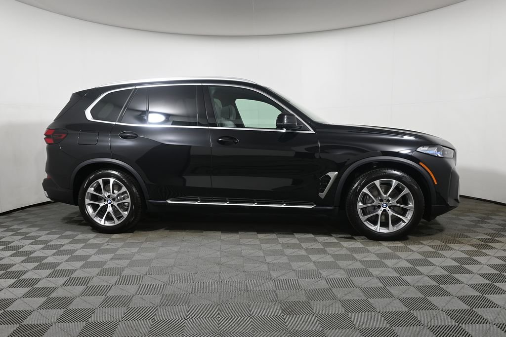 New 2026 Black Sapphire Metallic BMW xDrive50e image 8