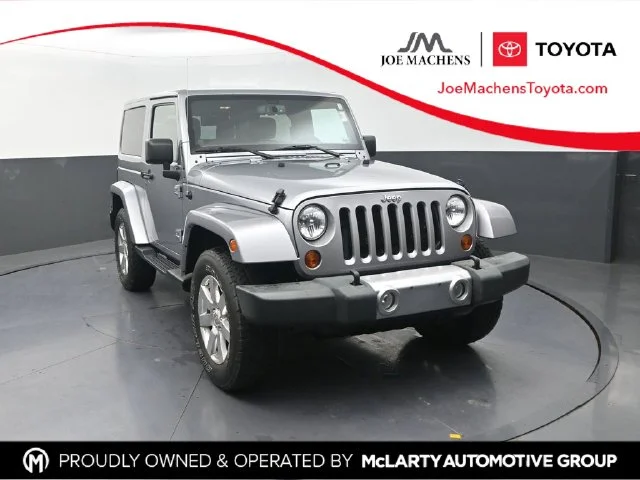 Used 2013 Silver Jeep Sahara image 1