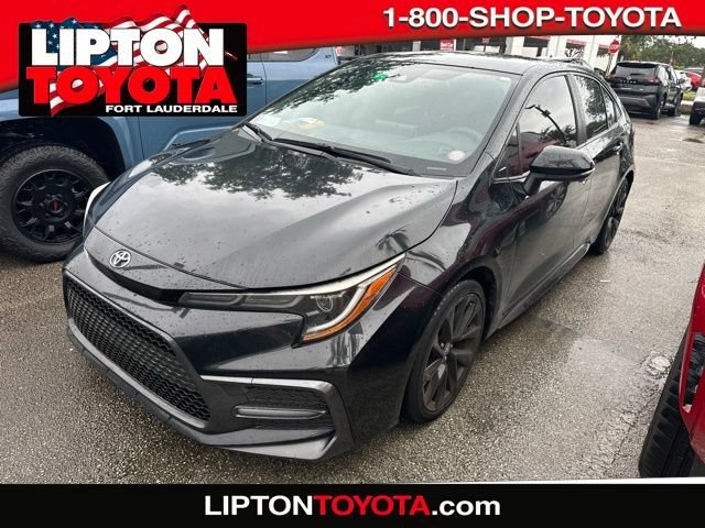 Used 2021 Black Sand Pearl Toyota SE image 1