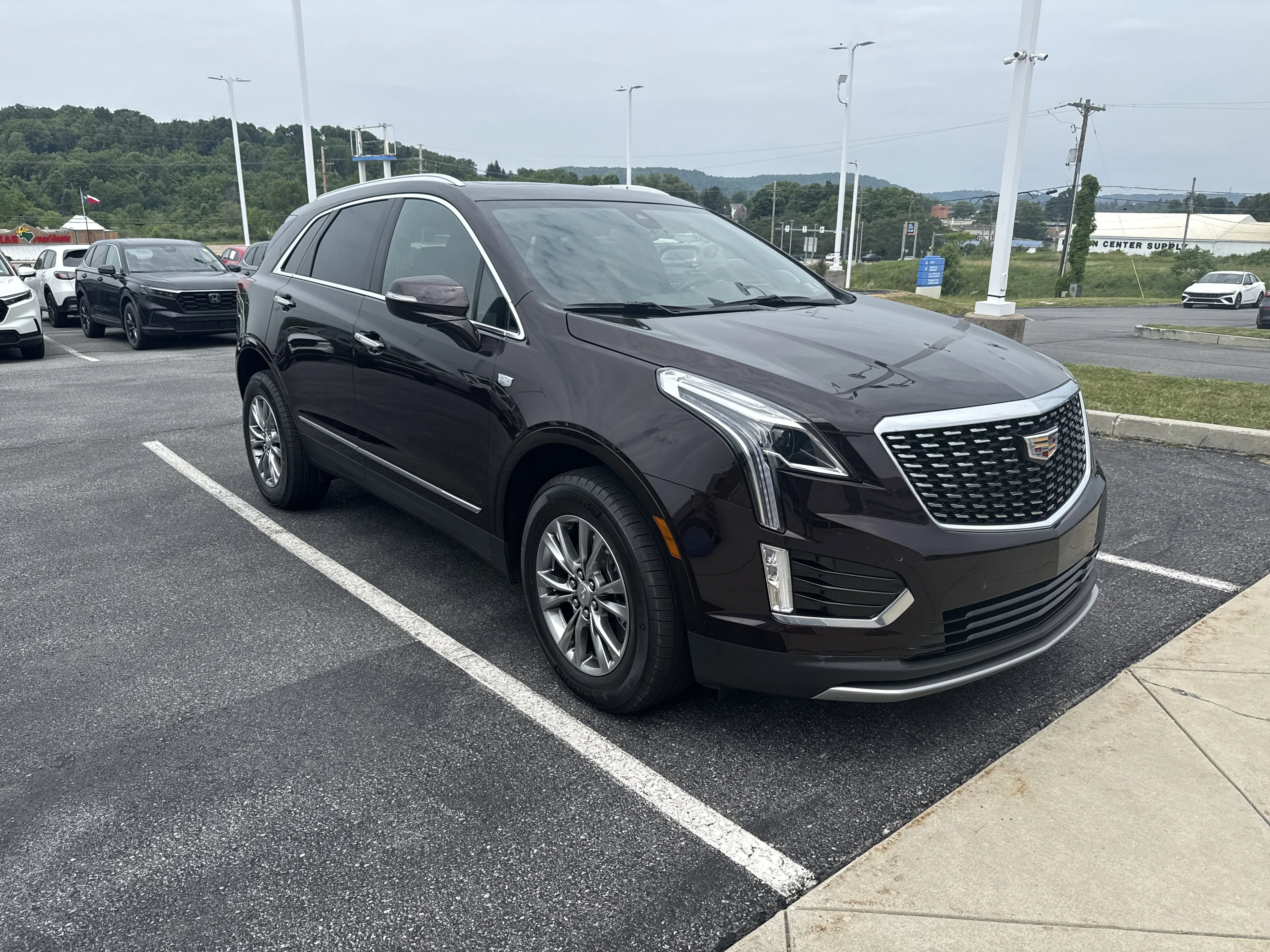Used 2021 Garnet Metallic Cadillac AWD Premium Luxury image 1