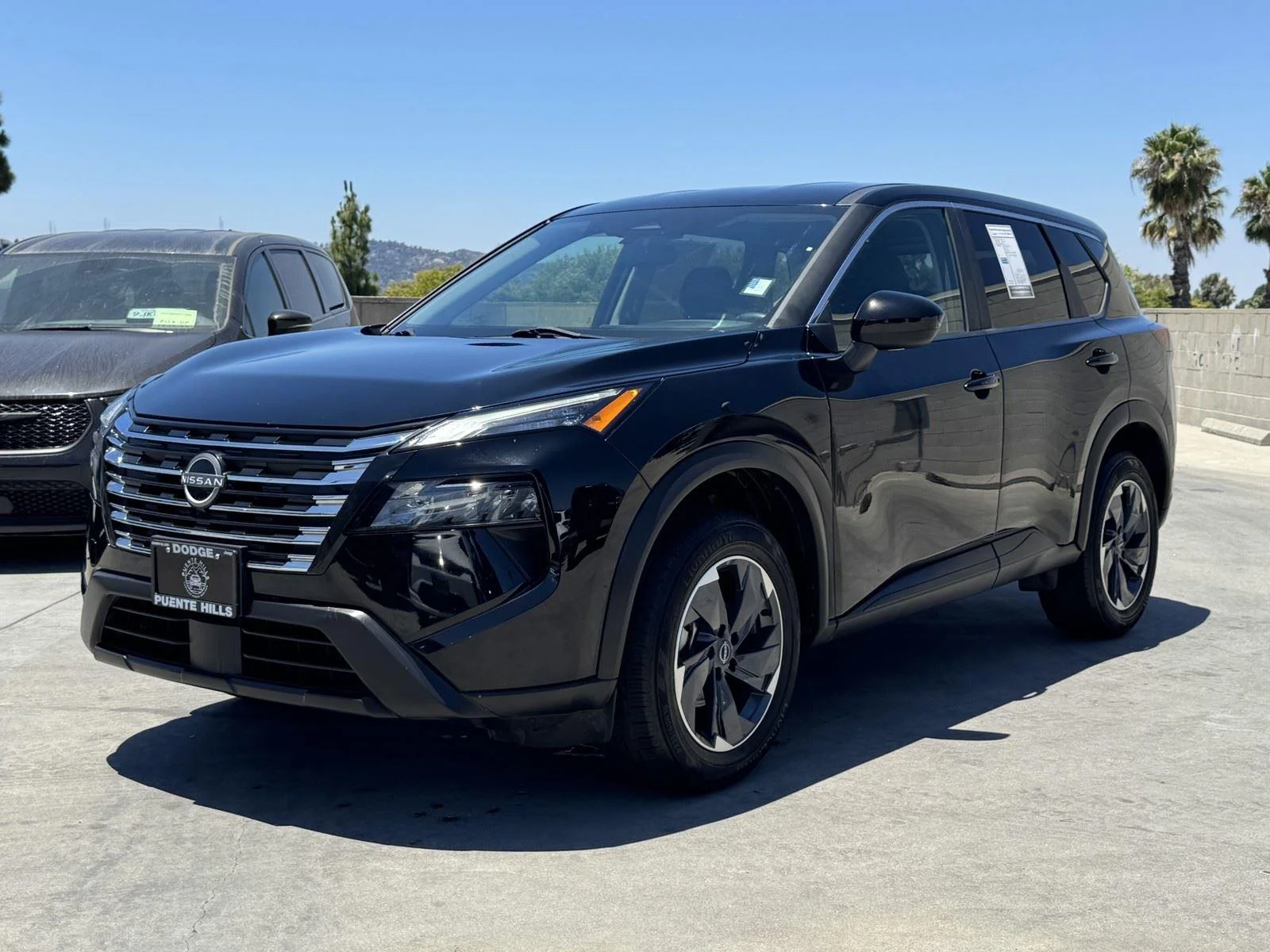 Used 2024 Super Black Nissan SV image 3