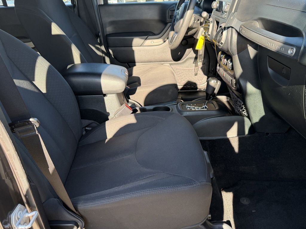 Used 2016 Granite Crystal Clearcoat Metallic Jeep Unlimited Sport image 14