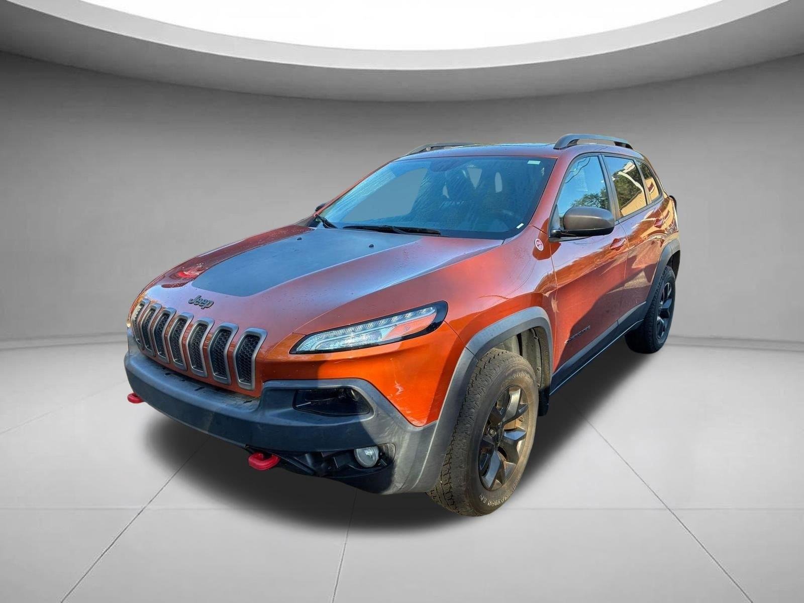 Used 2016 Mango Tango Pearlcoat Jeep Trailhawk image 1