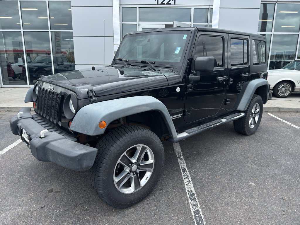 Used 2011 Black Clearcoat Jeep Sport image 1