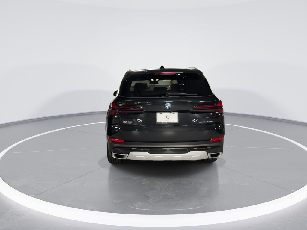 New 2026 Black Sapphire Metallic BMW xDrive50e image 7