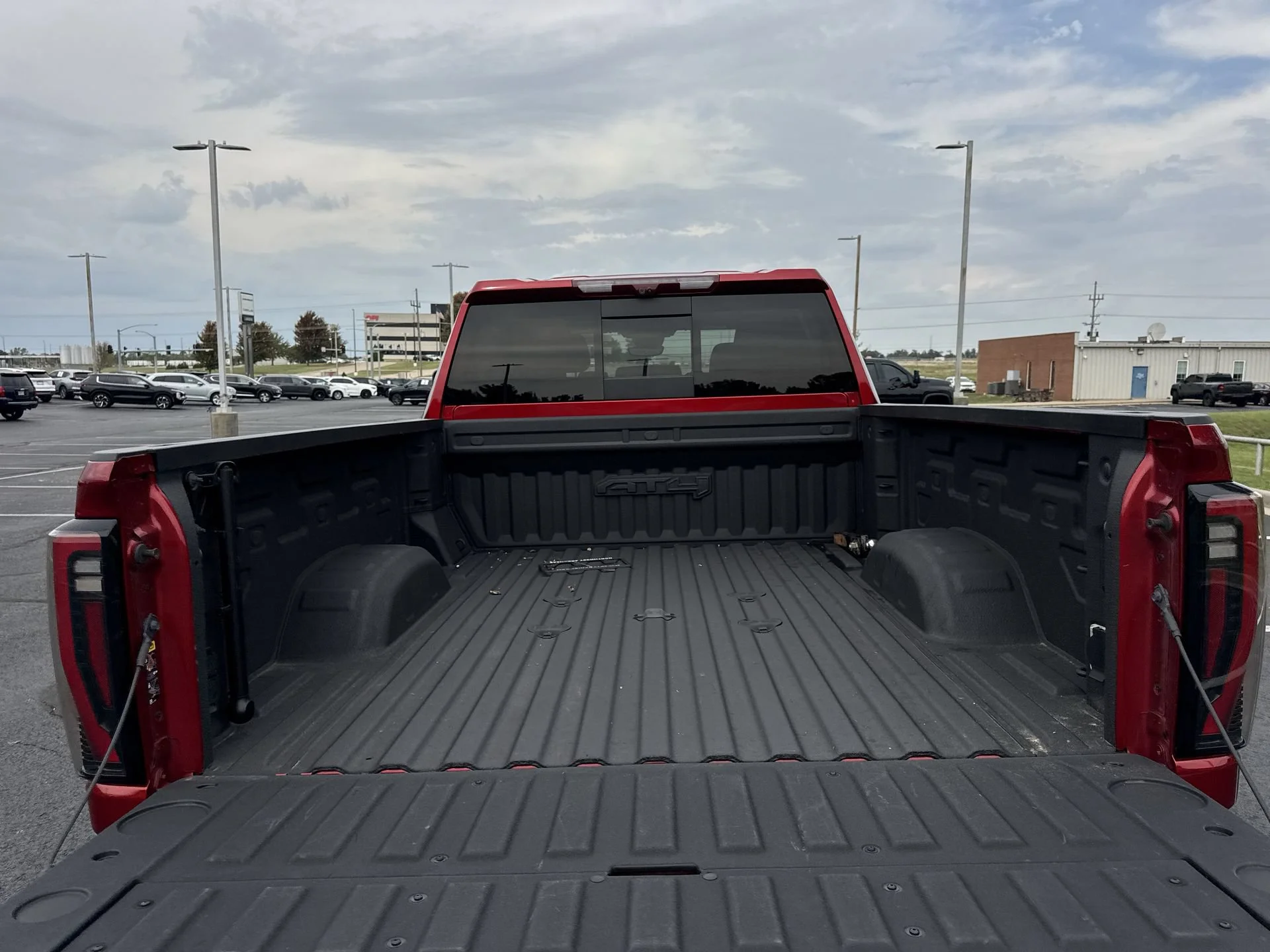 Used 2024 Volcanic Red Tintcoat GMC AT4 image 24