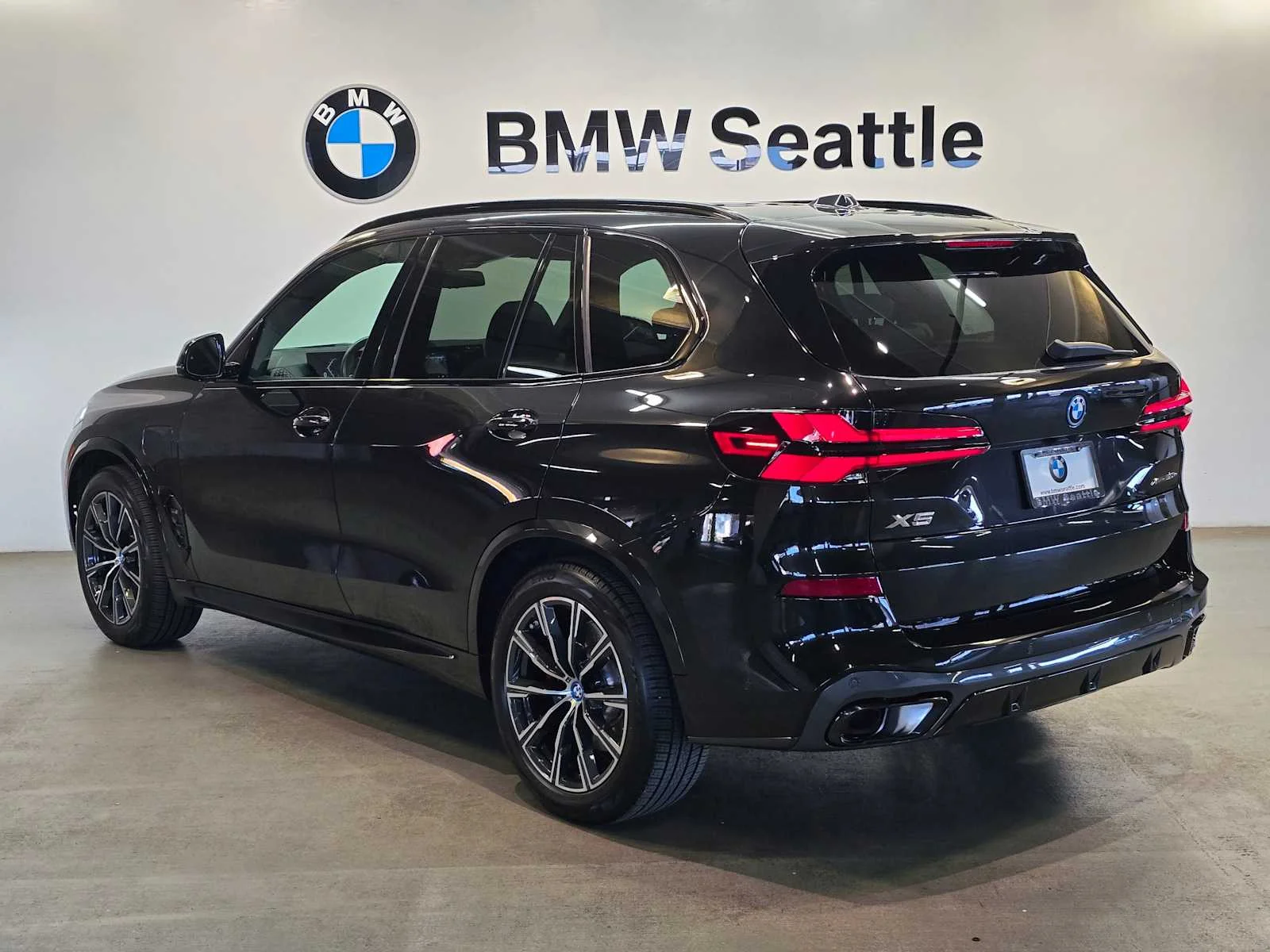 Used 2024 Black Sapphire Metallic BMW xDrive50e image 4