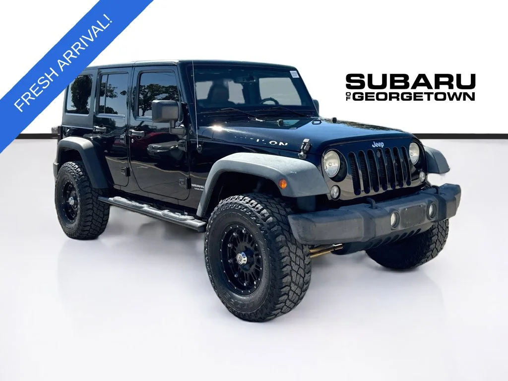 Used 2014 Black Jeep Unlimited Rubicon image 1