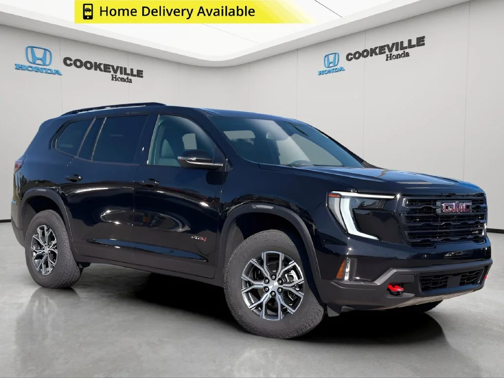 Used 2024 Ebony Twilight Metallic GMC AT4 image 1