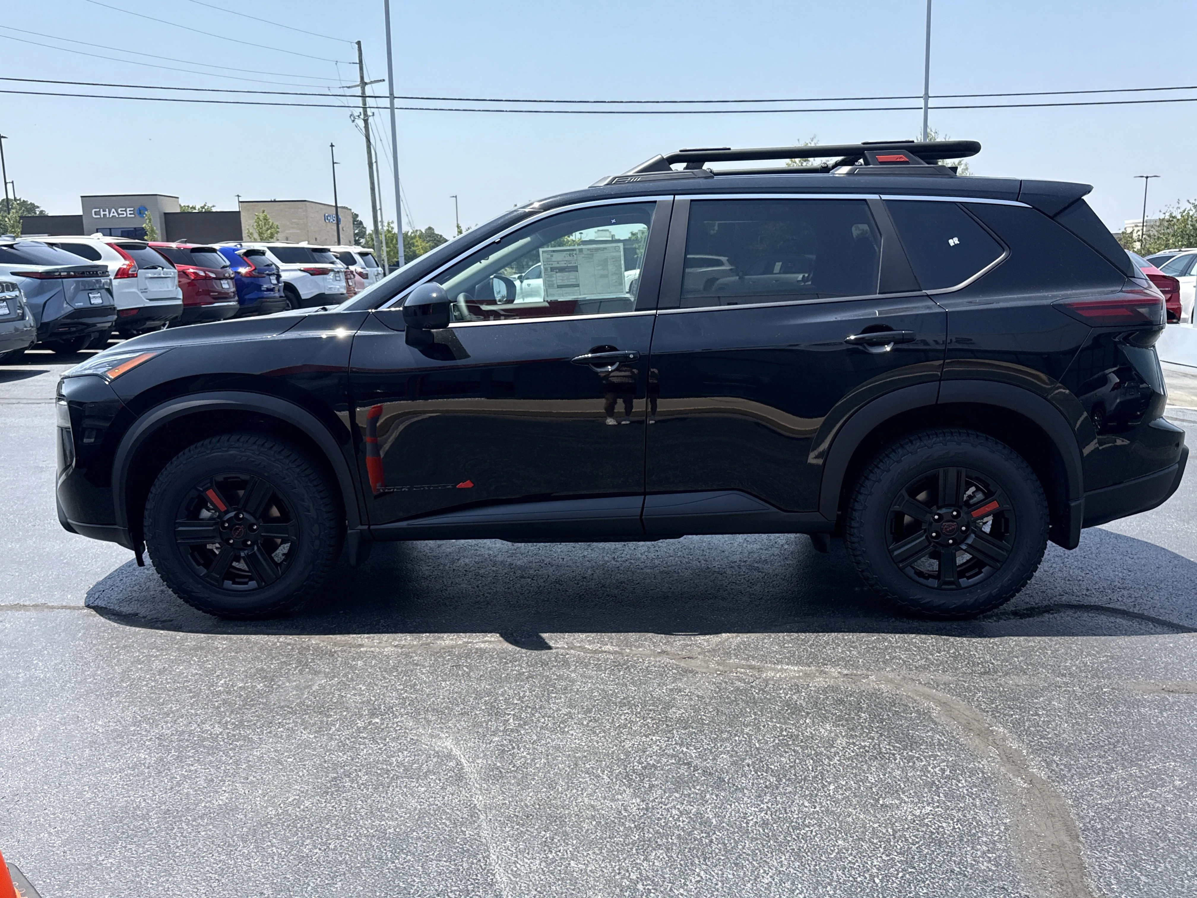 New 2026 Super Black Nissan Rock Creek AWD image 9