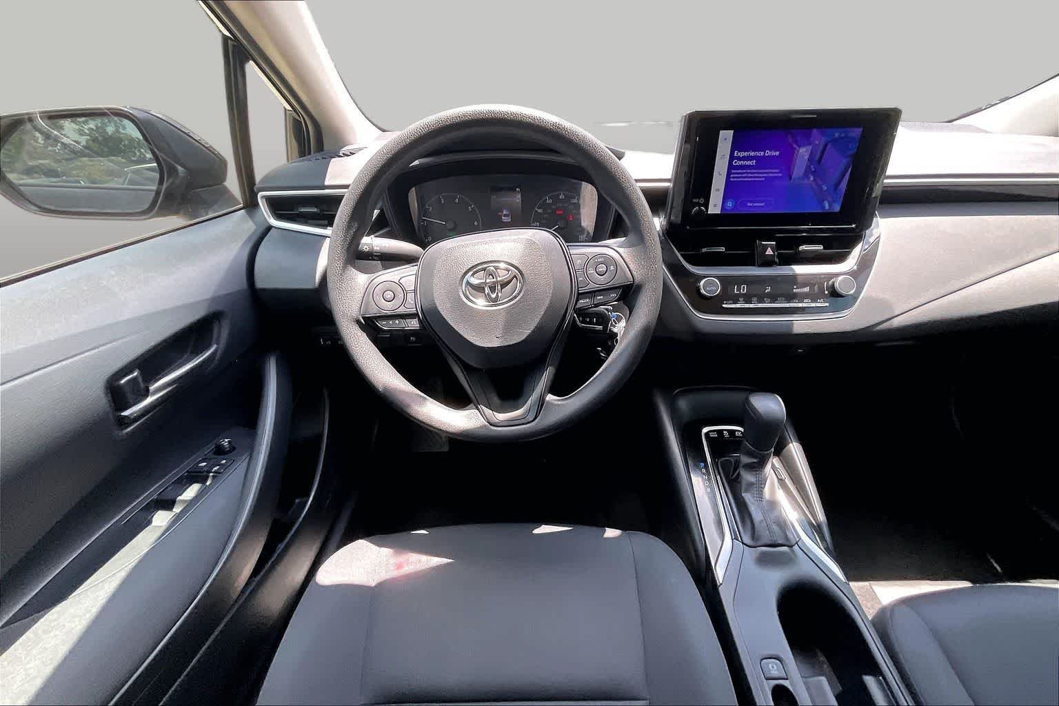 Used 2025 Midnight Black Metallic Toyota Hybrid LE image 6