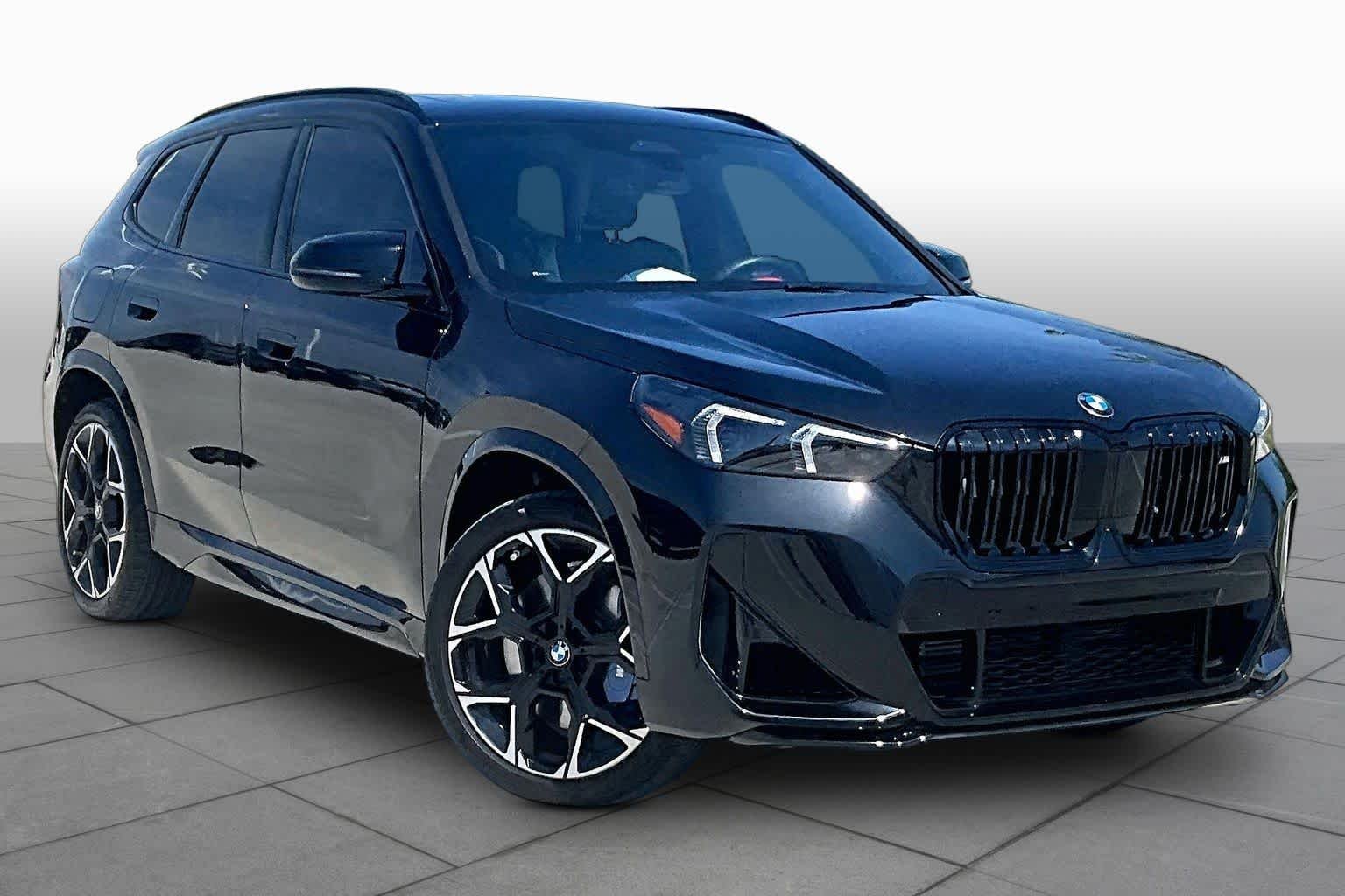 Used 2026 Black Sapphire Metallic BMW M35i image 2