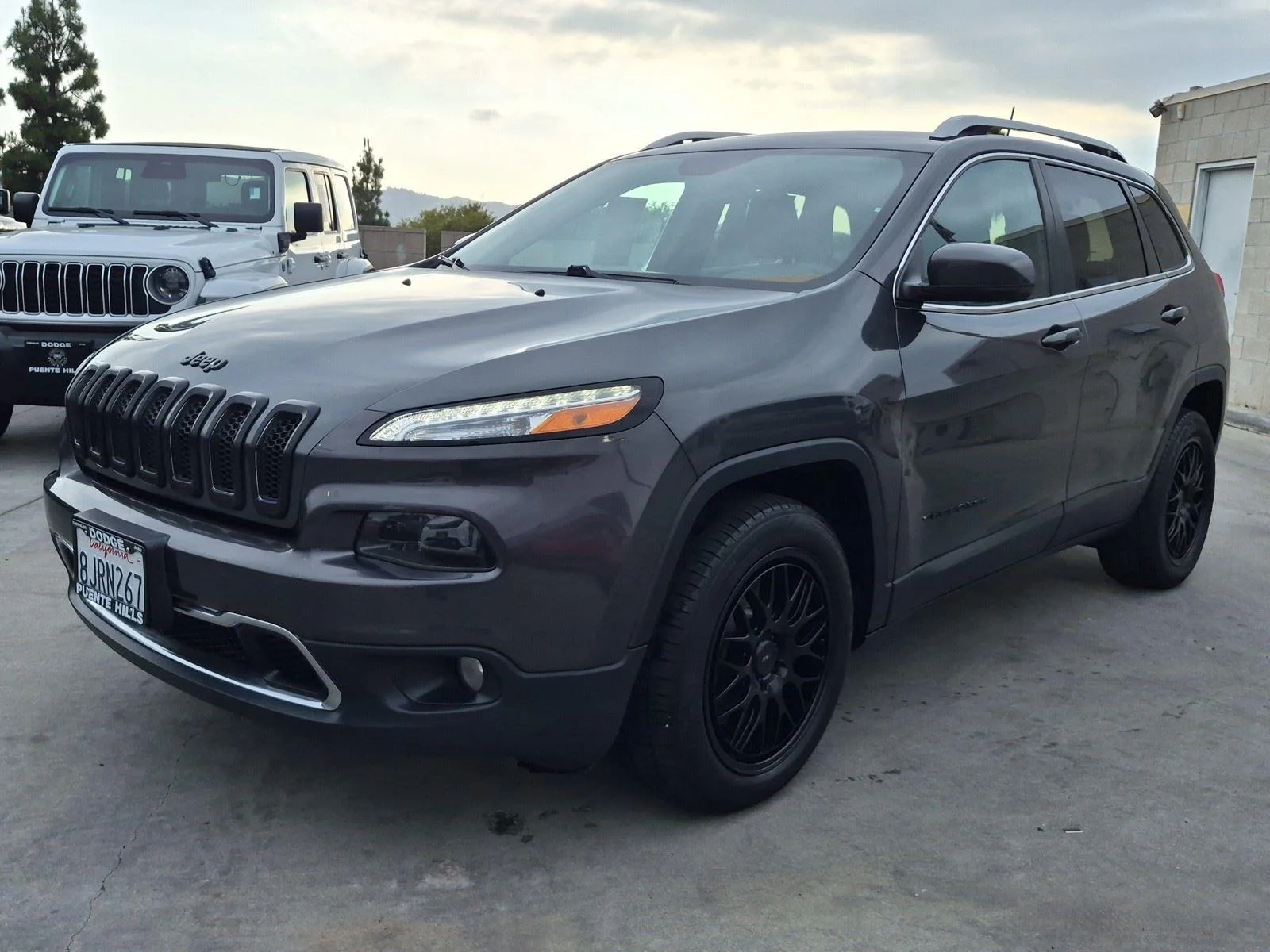 Used 2016 Granite Crystal Metallic Clearcoat Jeep Limited image 3