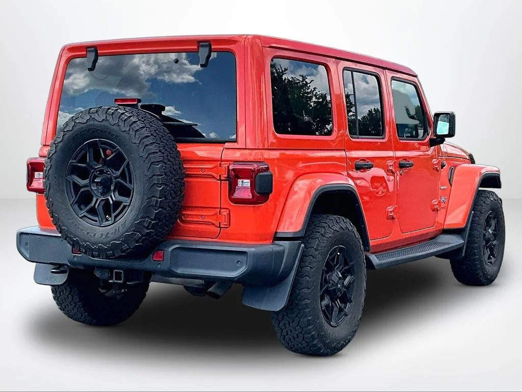 Used 2018 Orange Jeep Unlimited Sahara image 2