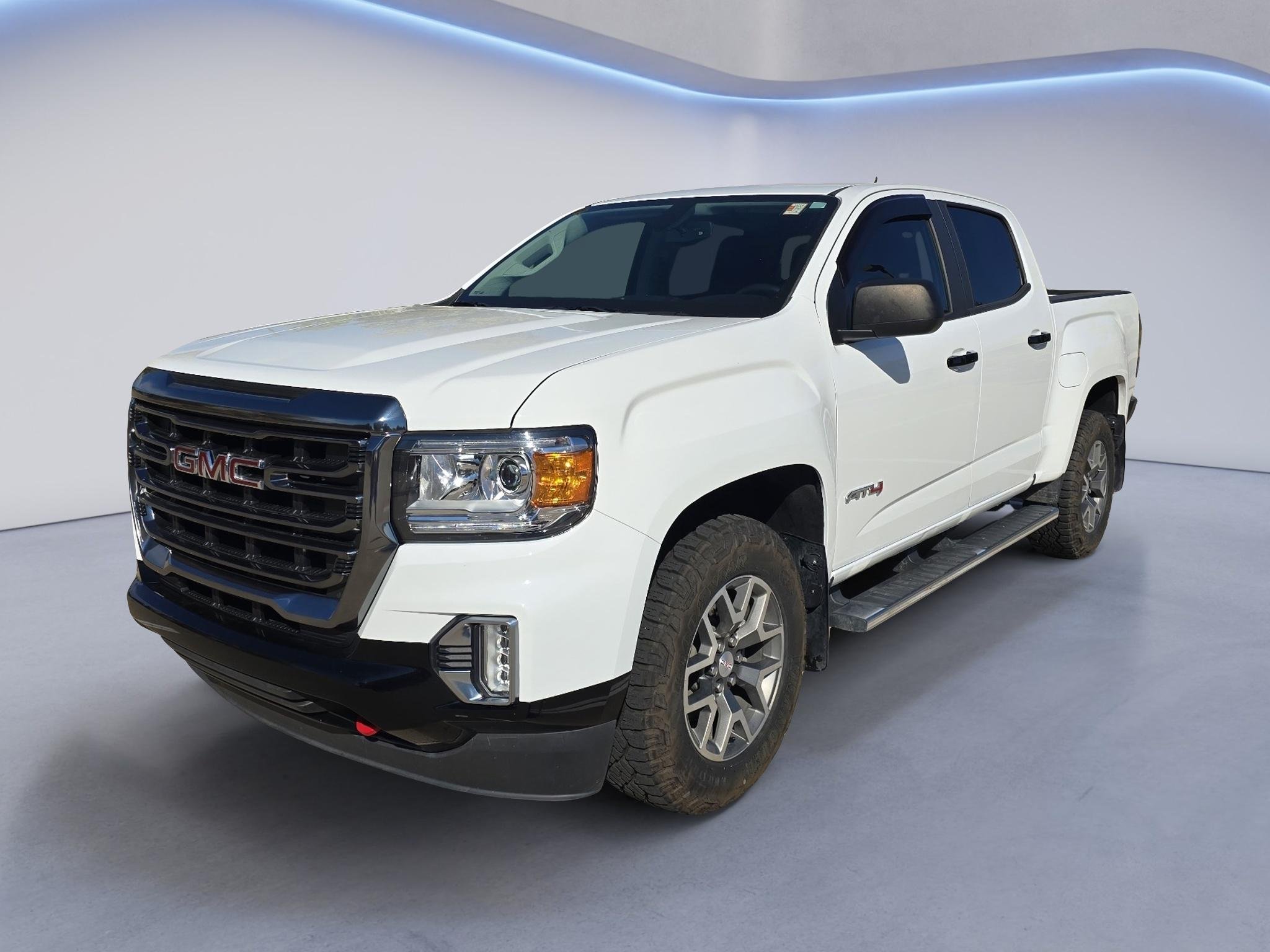 Used 2021 Summit White GMC 4WD AT4 w/Cloth image 1